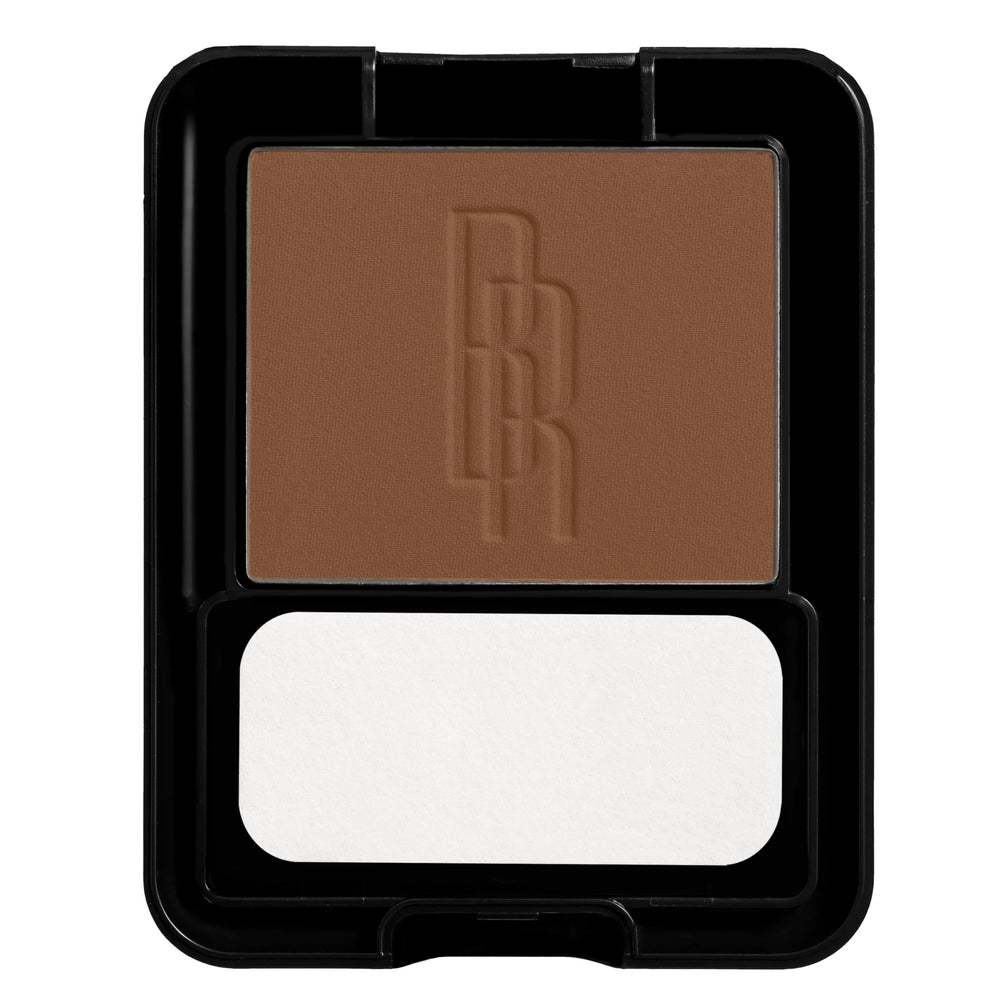 Black Radiance pressed powder with included brush for easy blending.