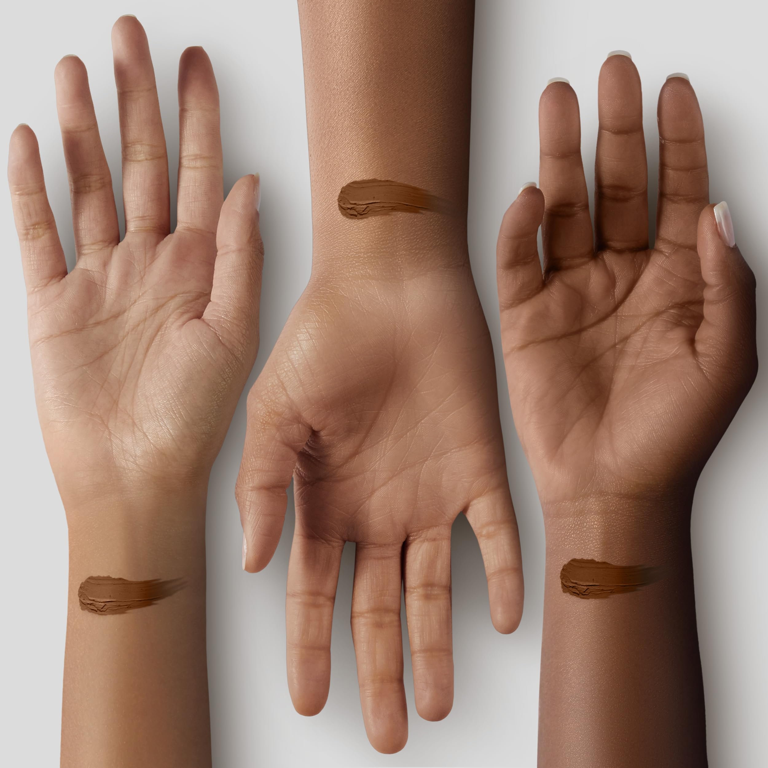 Applying Black Radiance concealer for a natural finish.