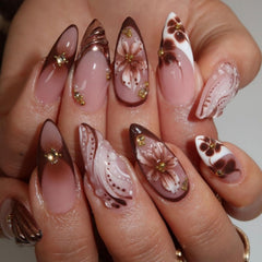 BLGTGH French tips almond nails with flower accents for a chic everyday look.