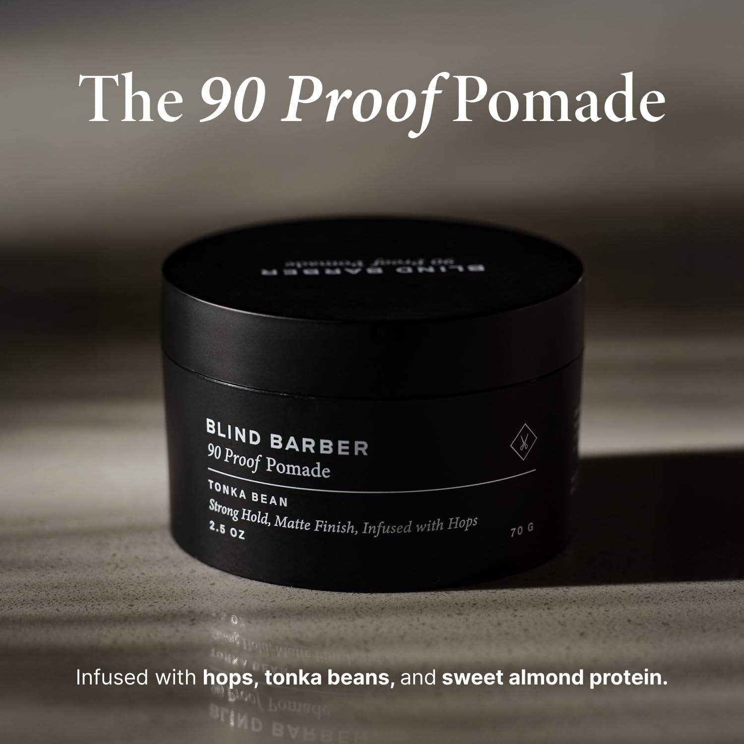 Close-up of Blind Barber 90 Proof pomade jar with easy washout.
