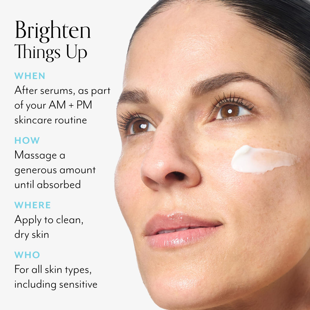 Applying Bliss Vitamin C + Tri-Peptide Brightening Moisturizer on the face for daily glow.