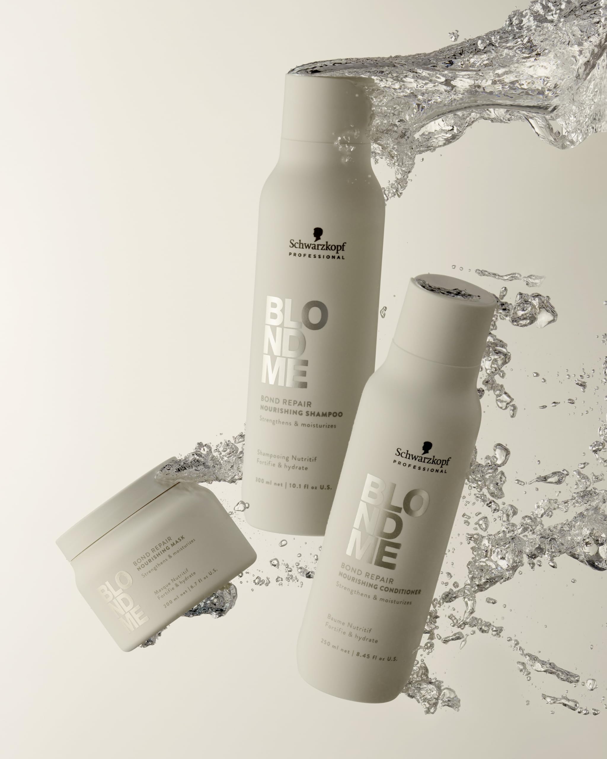 Hands lathering BlondMe Bond Repair Nourishing Shampoo during routine application