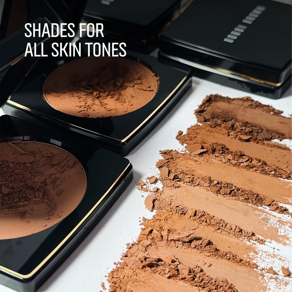 Bobbi Brown Bronzing Powder application on cheeks creates sculpted, sun-kissed definition.