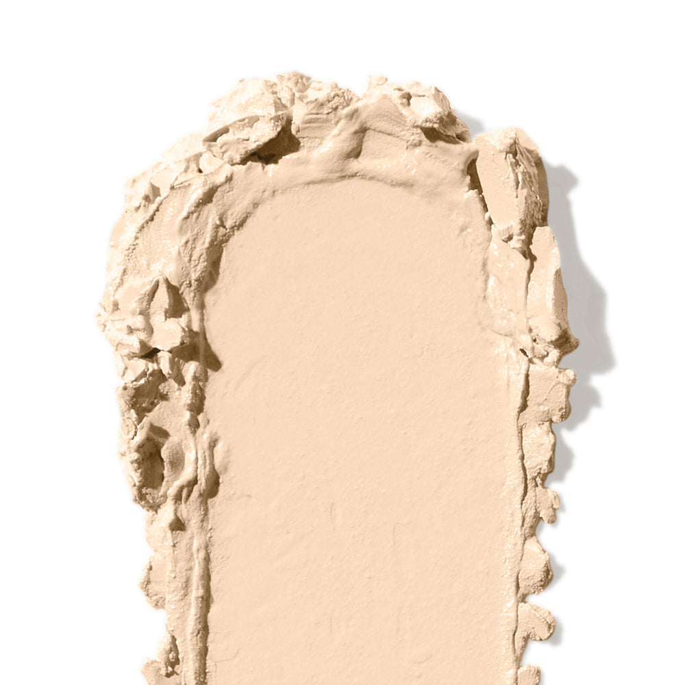 Bobbi Brown concealer stick covering a blemish with smooth, blendable finish