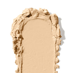 Bobbi Brown concealer stick close-up showing seamless blend and skin-like finish.
