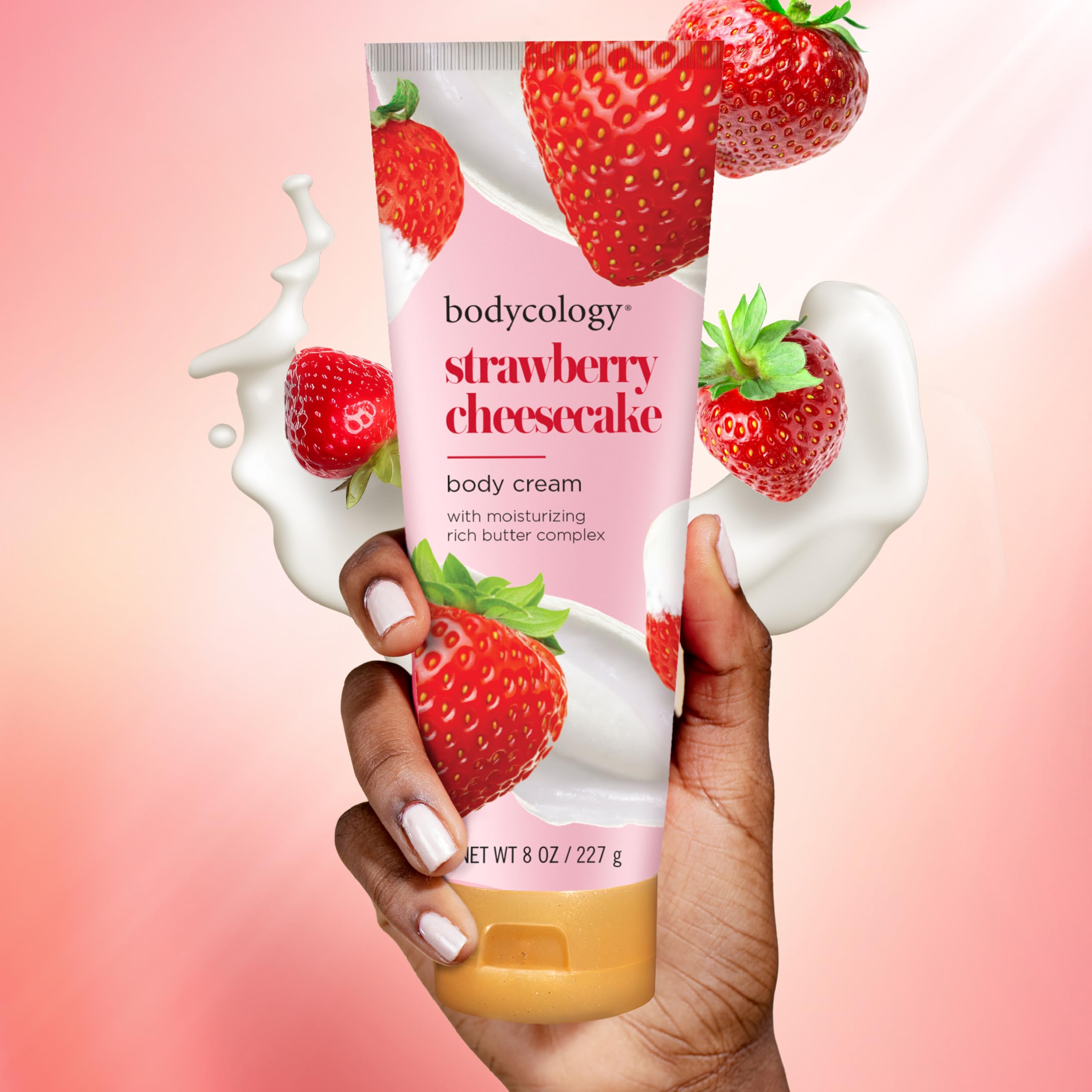 Bodycology Strawberry Cheesecake Cream being applied to skin for hydration.