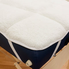 Body Linen Abundance Deluxe reversible fleece table pad showing both sides for seasonal comfort.