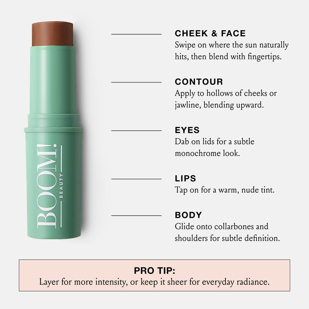 Boomstick Bronze body glow on collarbones for radiant warmth.