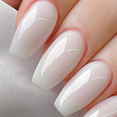 Brush application on nails shows smooth, even coverage for Born Pretty Milky White.