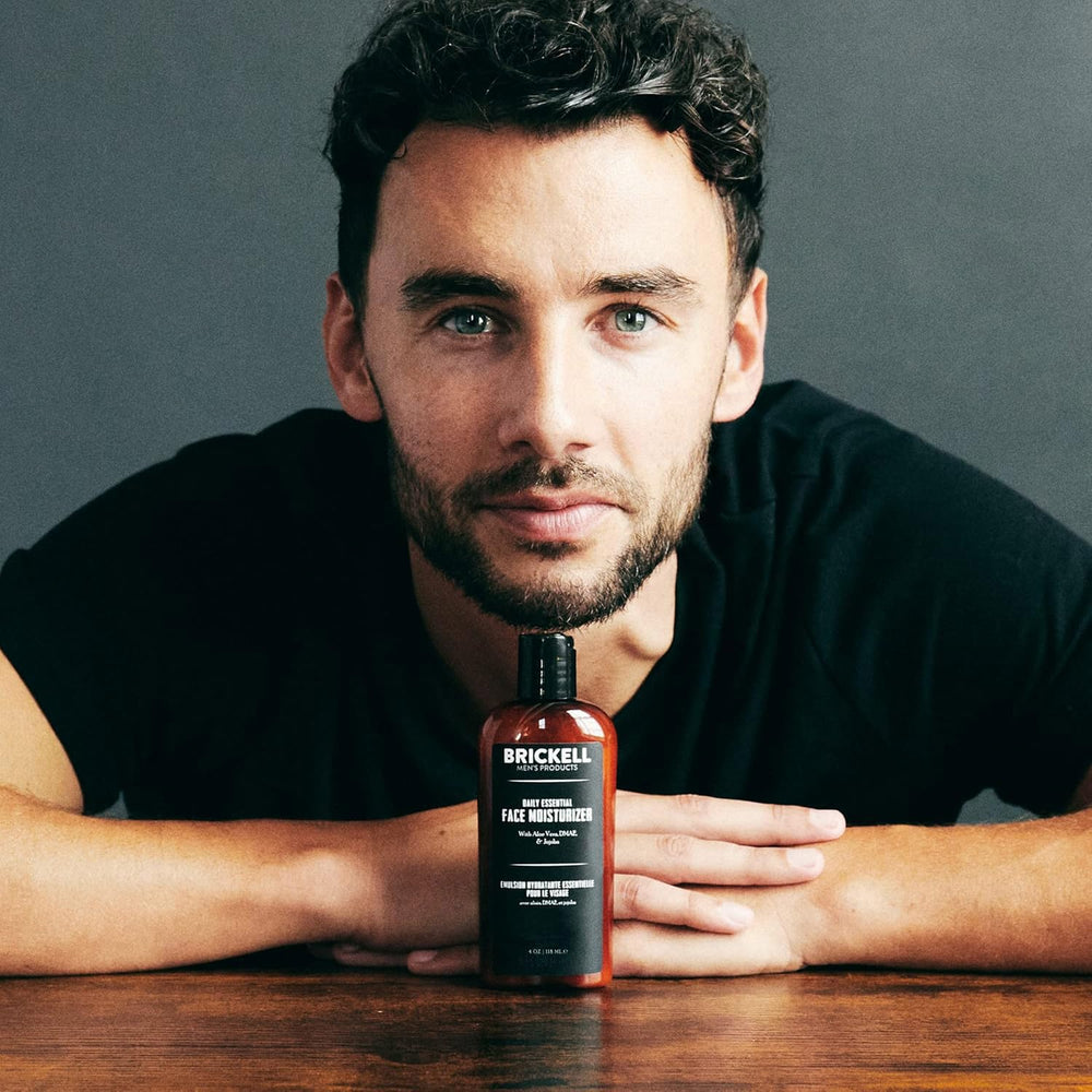 Man applying Brickell moisturizer in a morning routine