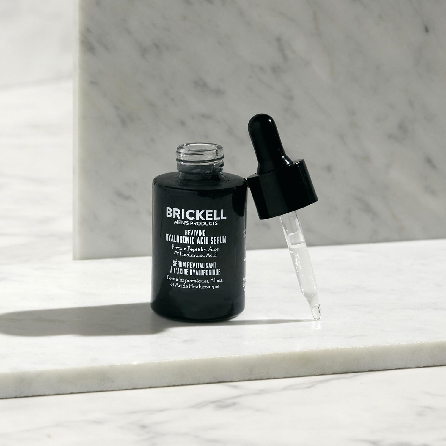 Brickell Hyaluronic Serum pump-action close-up showing easy dispensing.