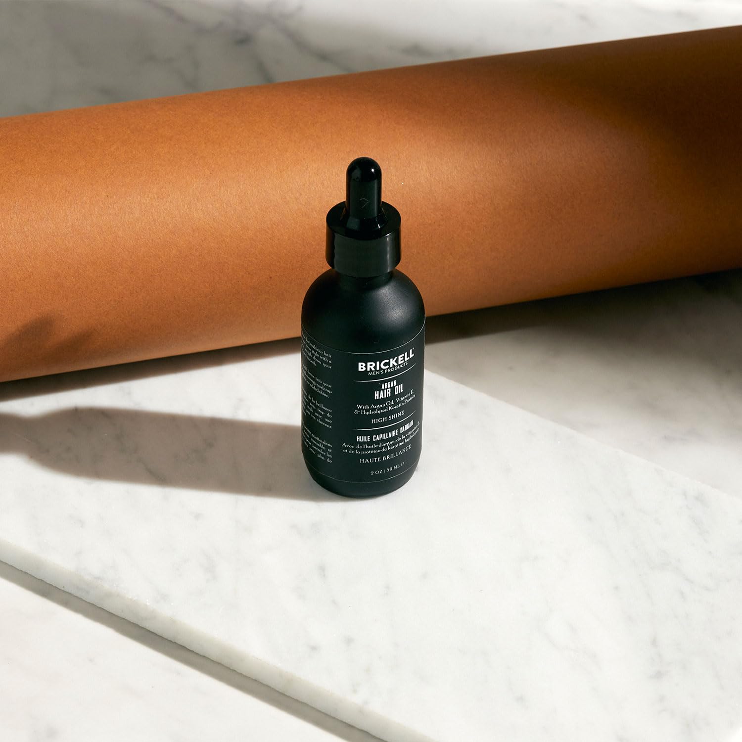Frizz control demonstrated with Brickell Men's Argan Oil on flyaways.