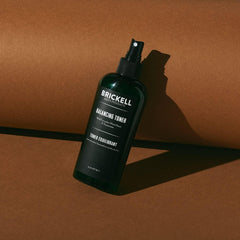 Brickell Men's Balancing Face Toner bottle cap close-up highlighting alcohol-free formula