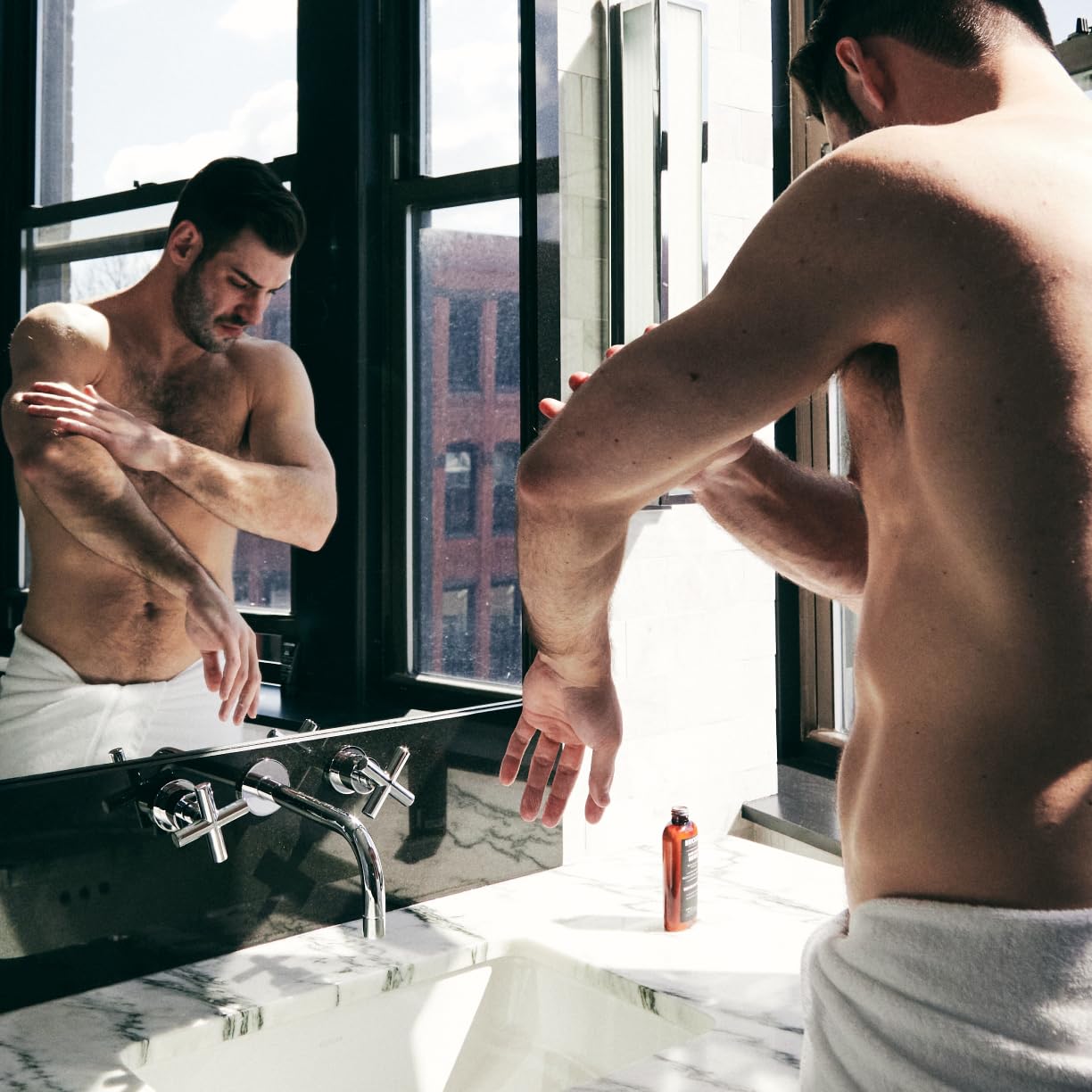 Bathroom scene with Brickell Deep Moisture suggesting daily use after shower.