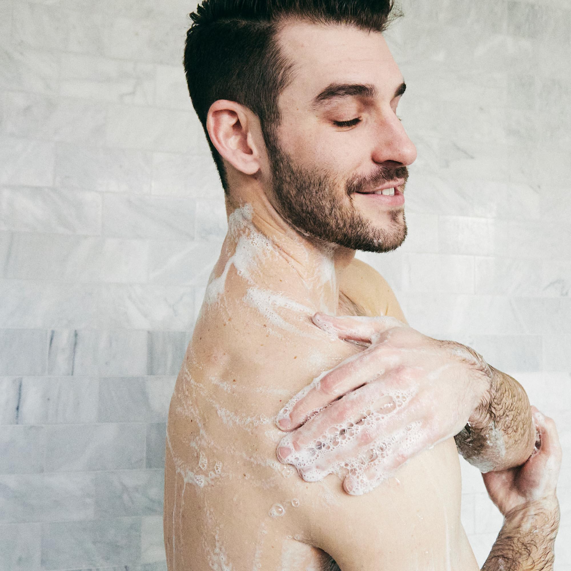 Brickell Men's Invigorating Body Wash close-up of aloe and jojoba.