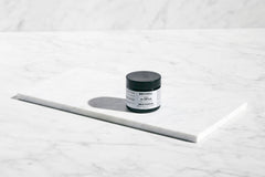 Brickell Men’s Anti-Aging Cream applying — close-up shows lightweight texture and fast absorption.