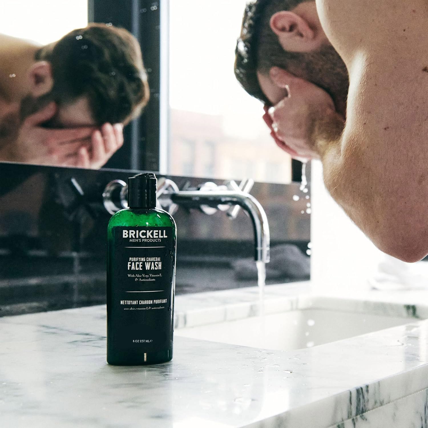 Brickell Purifying Charcoal Face Wash in a gym bag for post-workout refresh.
