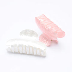 Brinie pink 8cm hair claw close-up showing sturdy grip and stylish color.
