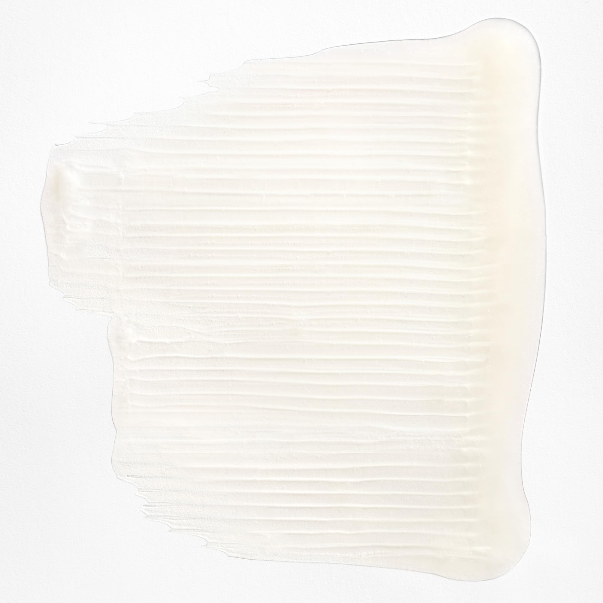 Creamy lather from Briogeo Curl Charisma close-up on defined curls.