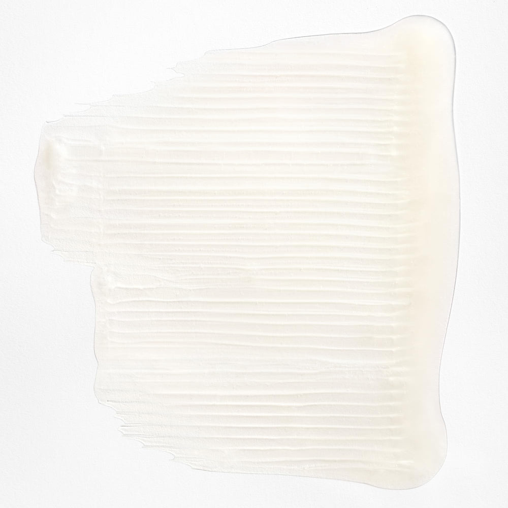 Creamy lather from Briogeo Curl Charisma close-up on defined curls.