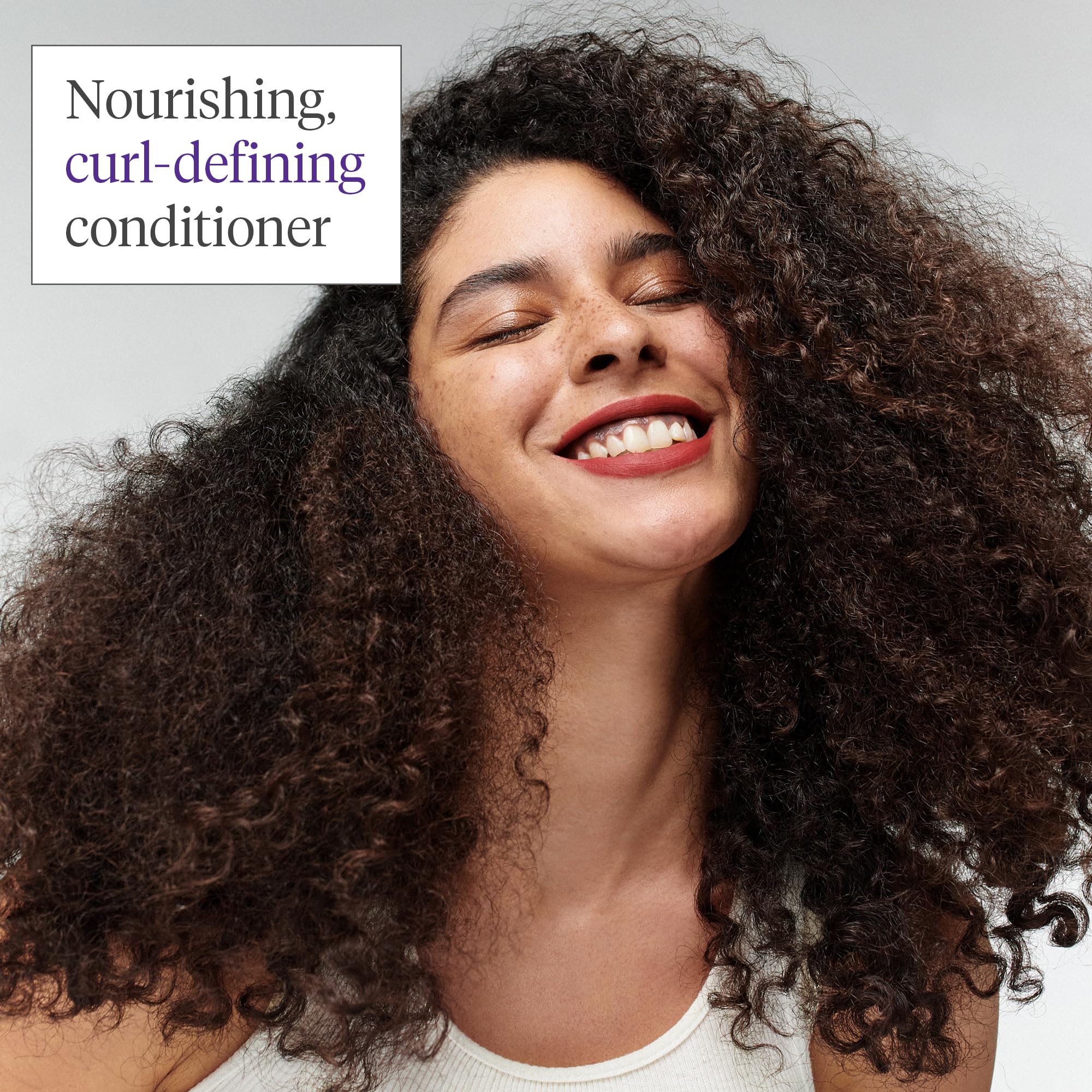 Close-up of Briogeo Curl Charisma on hair demonstrates moisture and curl definition.
