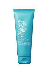 Briogeo Style and Treat Yuzu Plum Air Dry Cream bottle enables heatless styling.