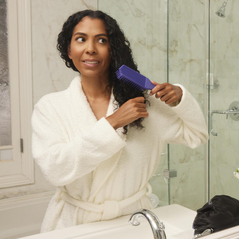 Brush With The Best Purple Detangler Brush works across all hair types.