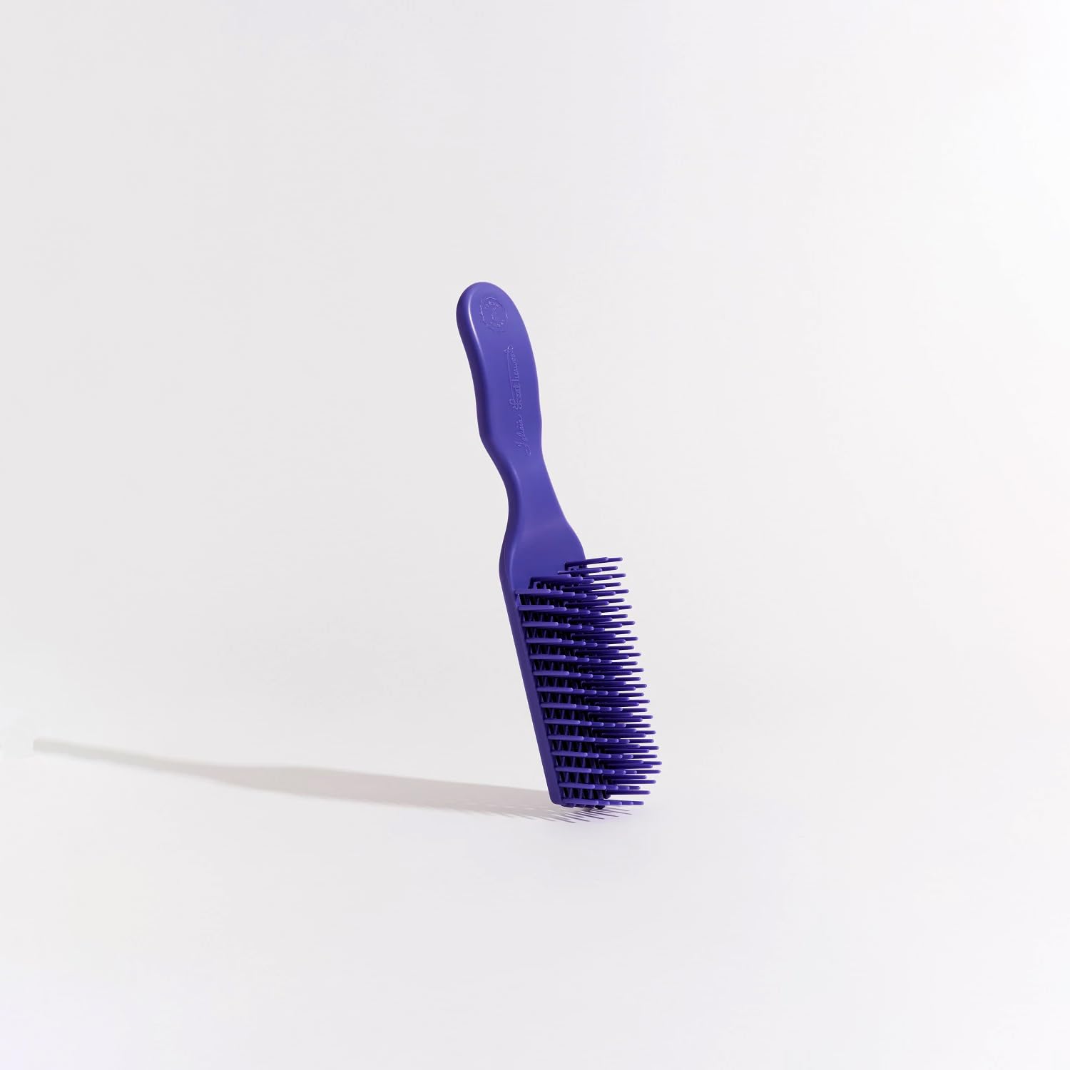 Brush With The Best Purple Detangler Brush flexi-bristles glide through knots.
