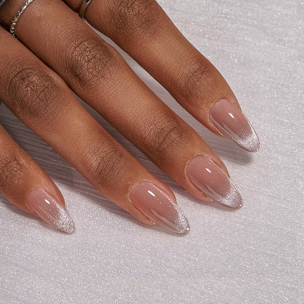 BTArtbox almond cat-eye French tip nails being prepared for application at home