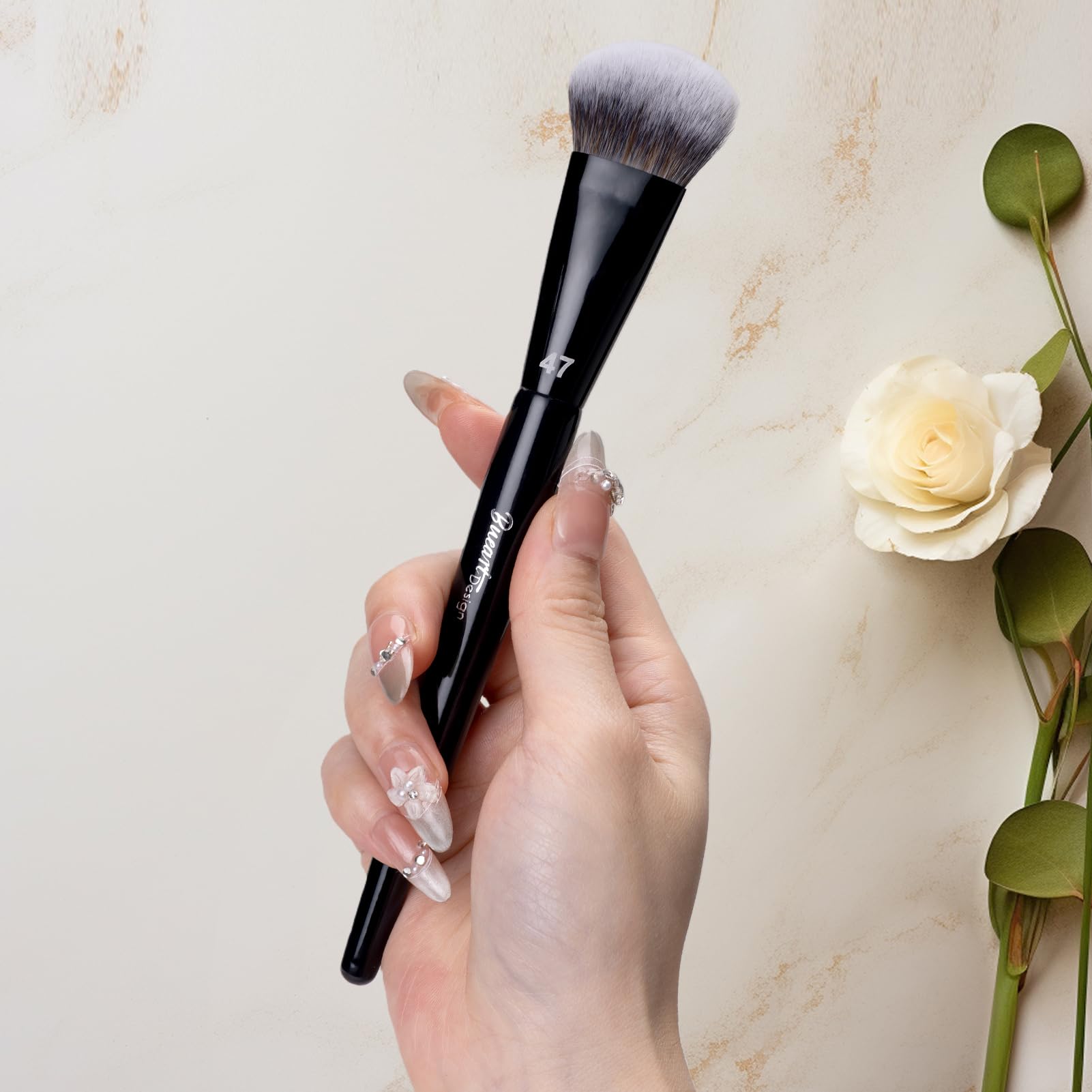 Bueart Design PRO Slope Foundation 47 brush on face enables even blending around contours.