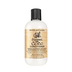 Bumble and bumble Creme De Coco conditioner bottle promotes rich moisture and shine.