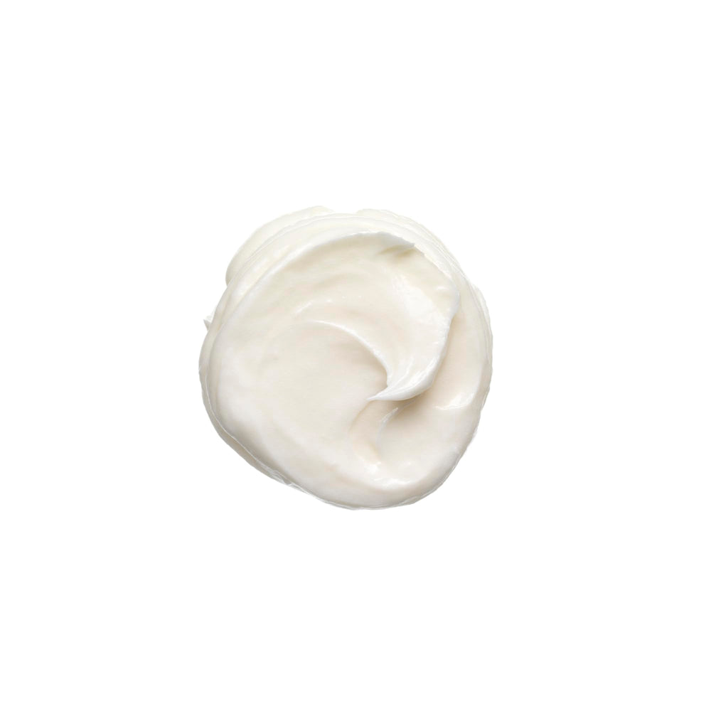 Bumble and bumble Don't Blow It Thick Air-Dry Cream applied to damp hair for bounce.