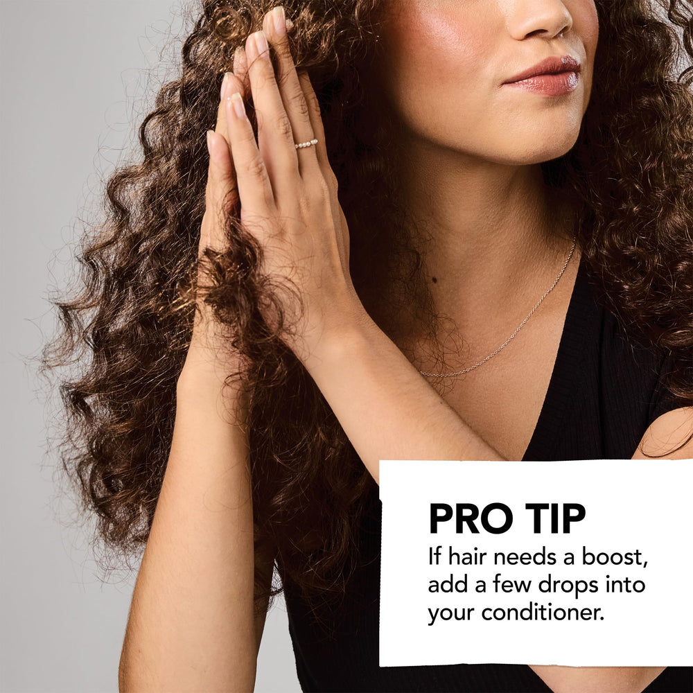Bumble and bumble frizz-reducing oil close-up reveals silky glossy finish
