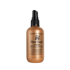 Bumble and bumble Heat Shield mist bottle pour shows easy heat protection.