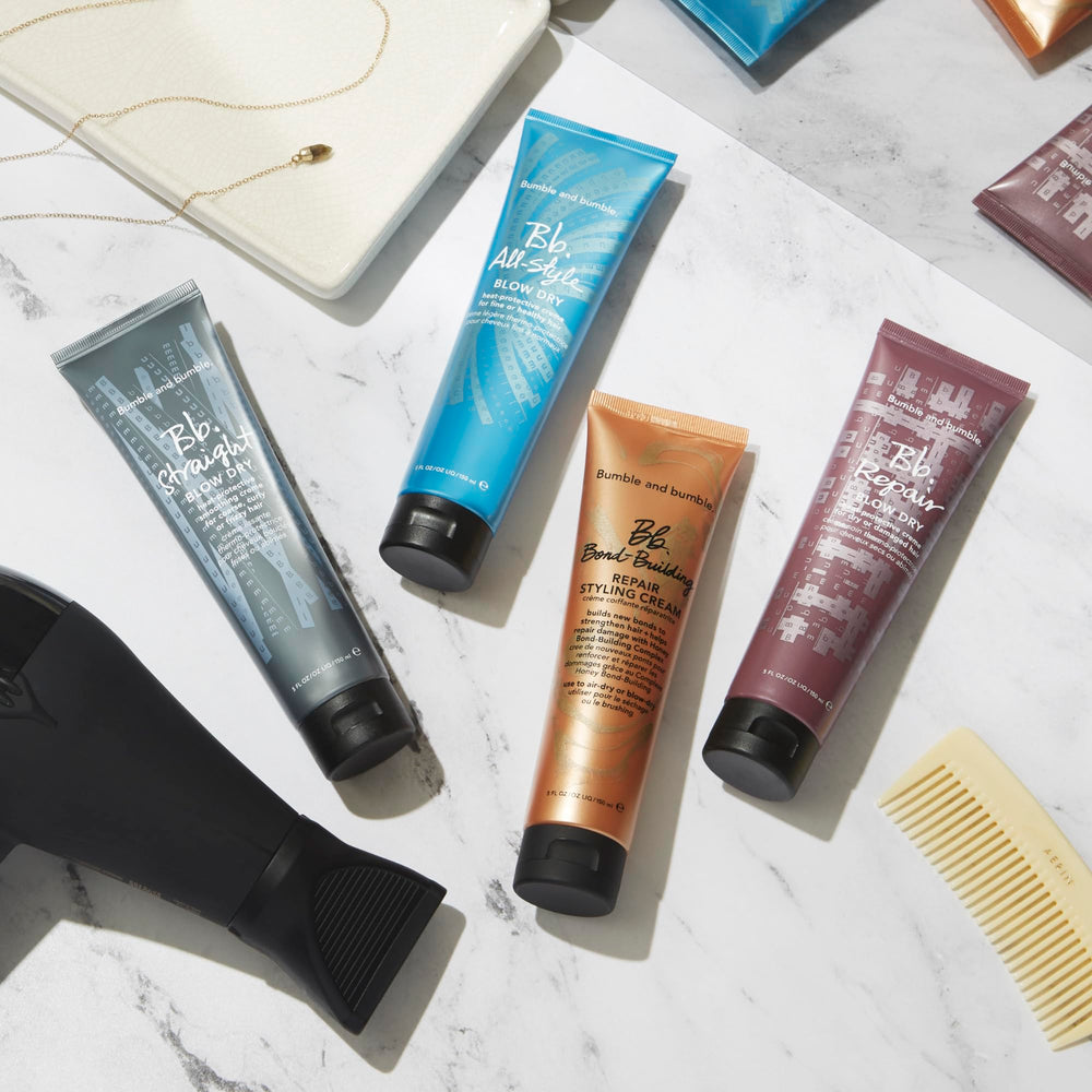 Bumble and bumble Straight Blow Dry Cream packaging highlighting frizz control and user-friendly protection.