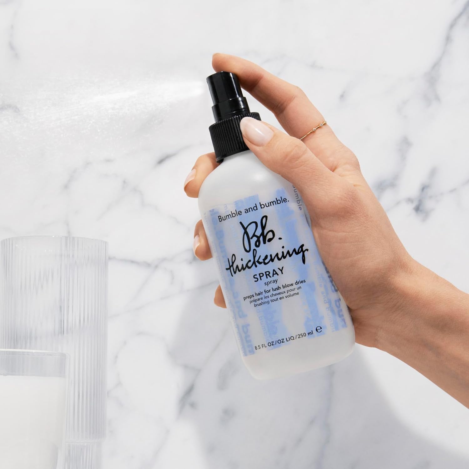 Bumble and bumble Thickening Blow-Dry Prep Spray mist application lifts roots for added volume.
