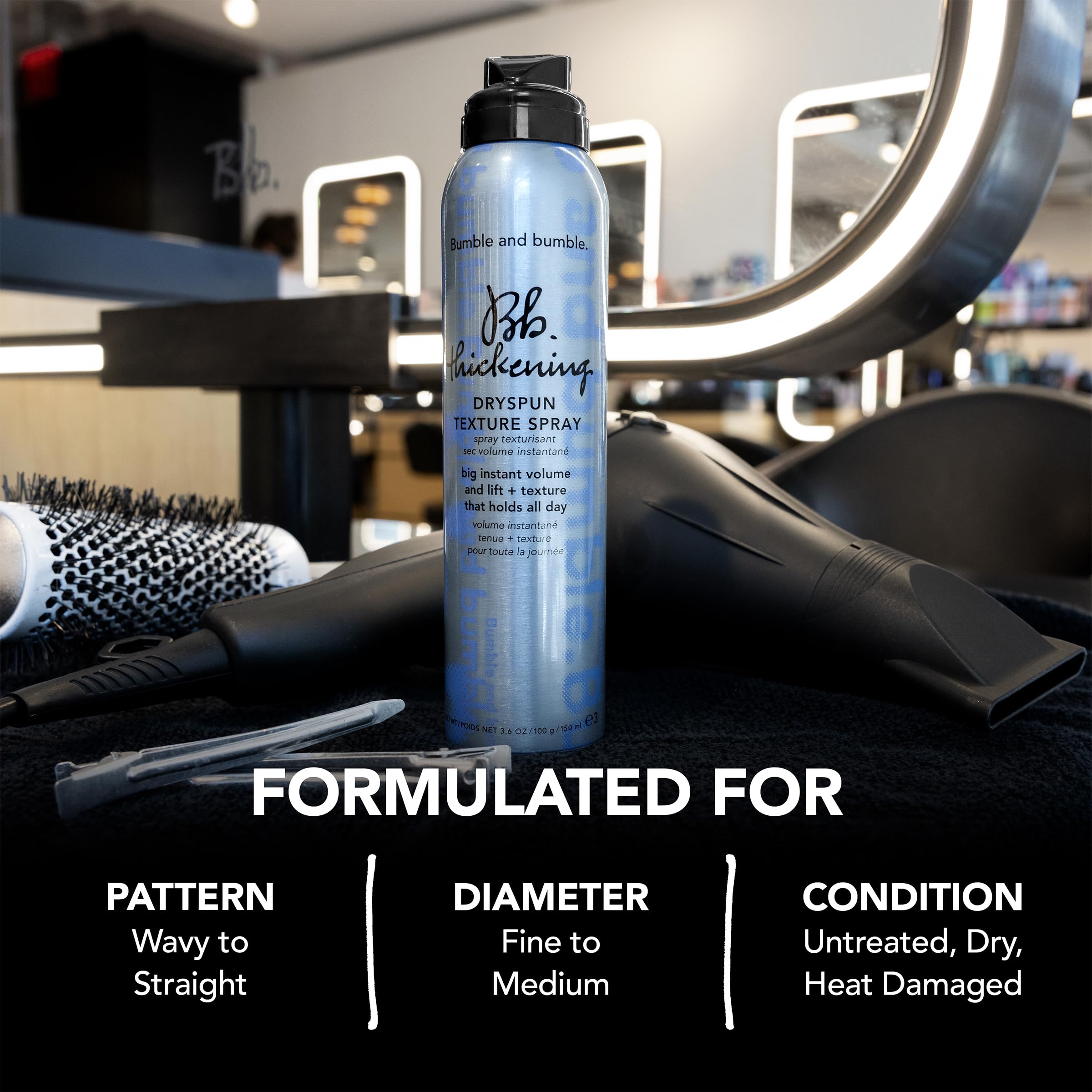 Hands holding Dryspun Texture Spray for styling grip