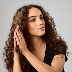 Bumble and bumble travel size oil 0.85 oz ideal for on-the-go touch-ups.