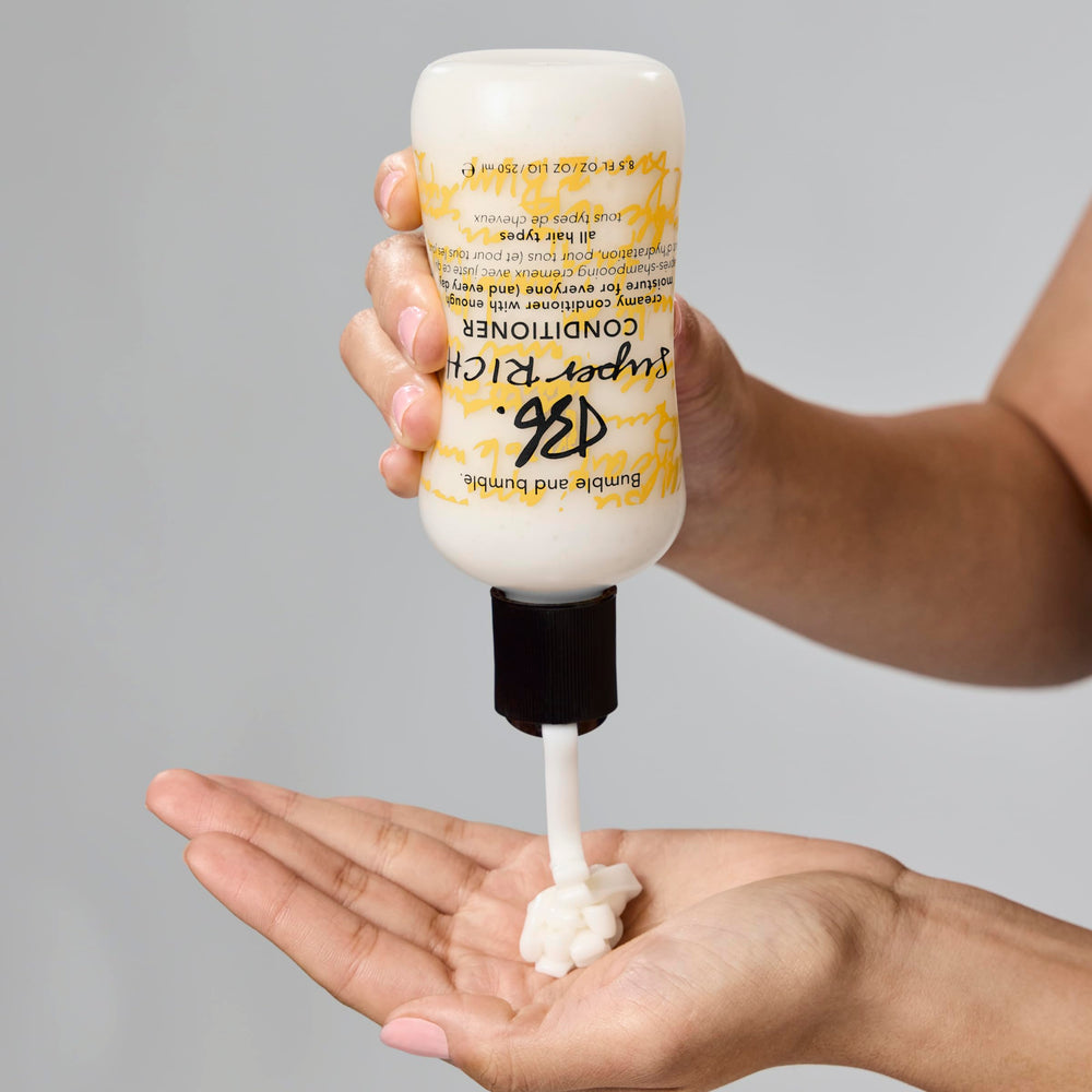 Packaging of Bumble and bumble Super Rich conditioner on a shelf.