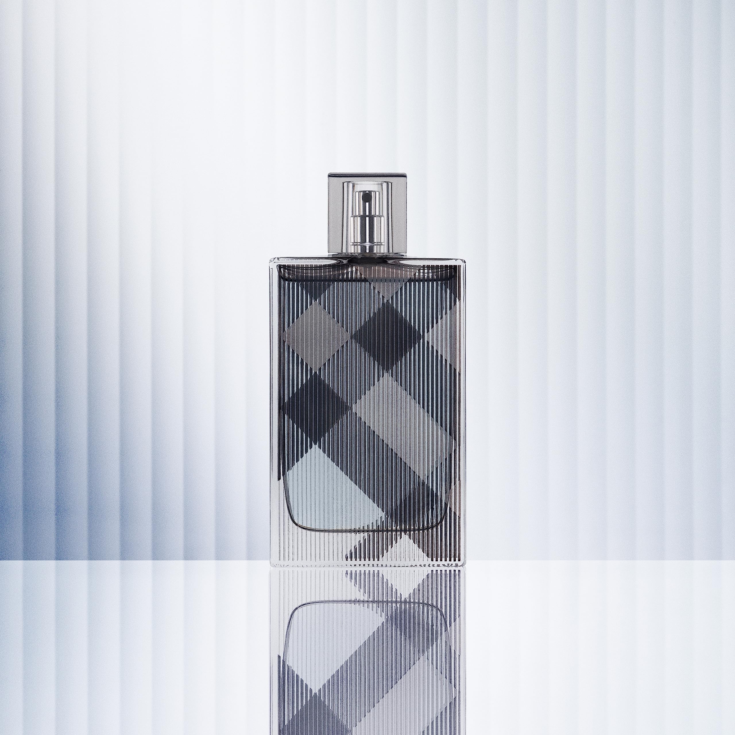 Burberry Brit for Him bottle close up cap showing premium design for gifting.