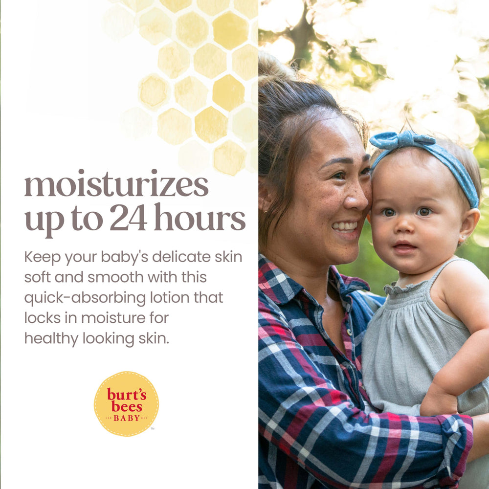 Hand applying Burt's Bees Baby Ultra Gentle Lotion to baby's soft skin.