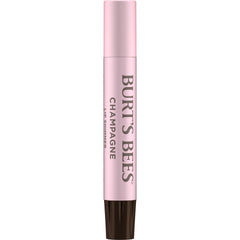 Burt's Bees Lip Shimmer Champagne wand highlights soft pink glow.