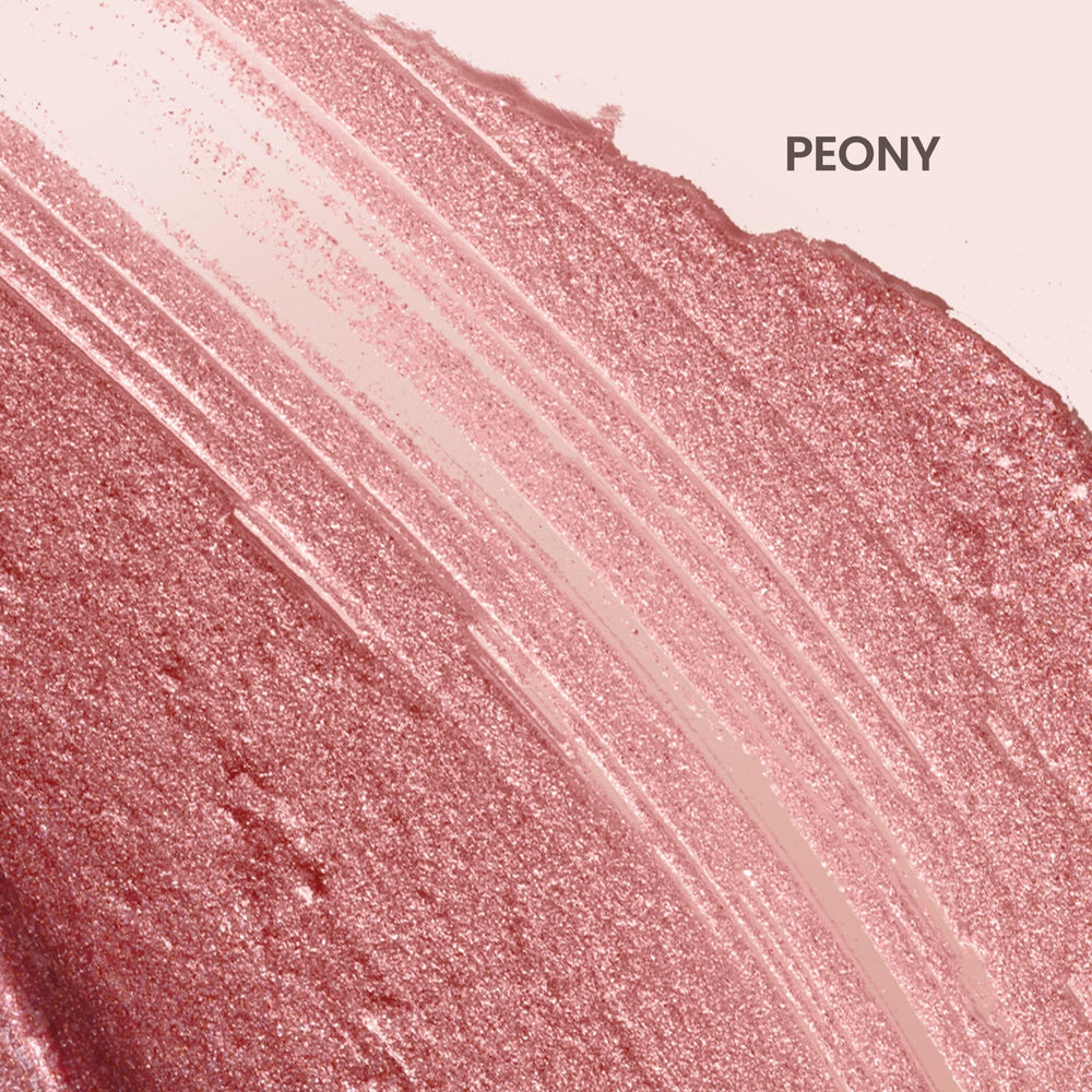 Swatch of Burt's Bees Lip Shimmer Peony reveals rosy pink shimmer.