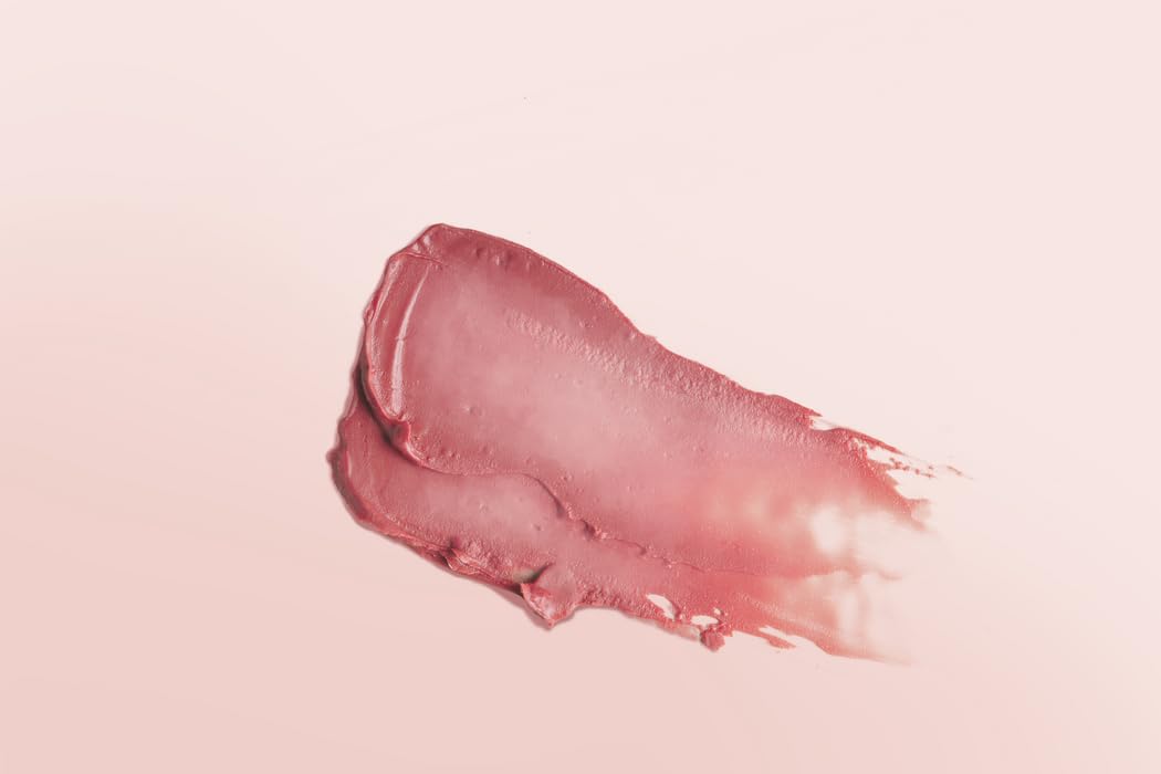 Application close-up shows even color and lightweight texture for daily lips