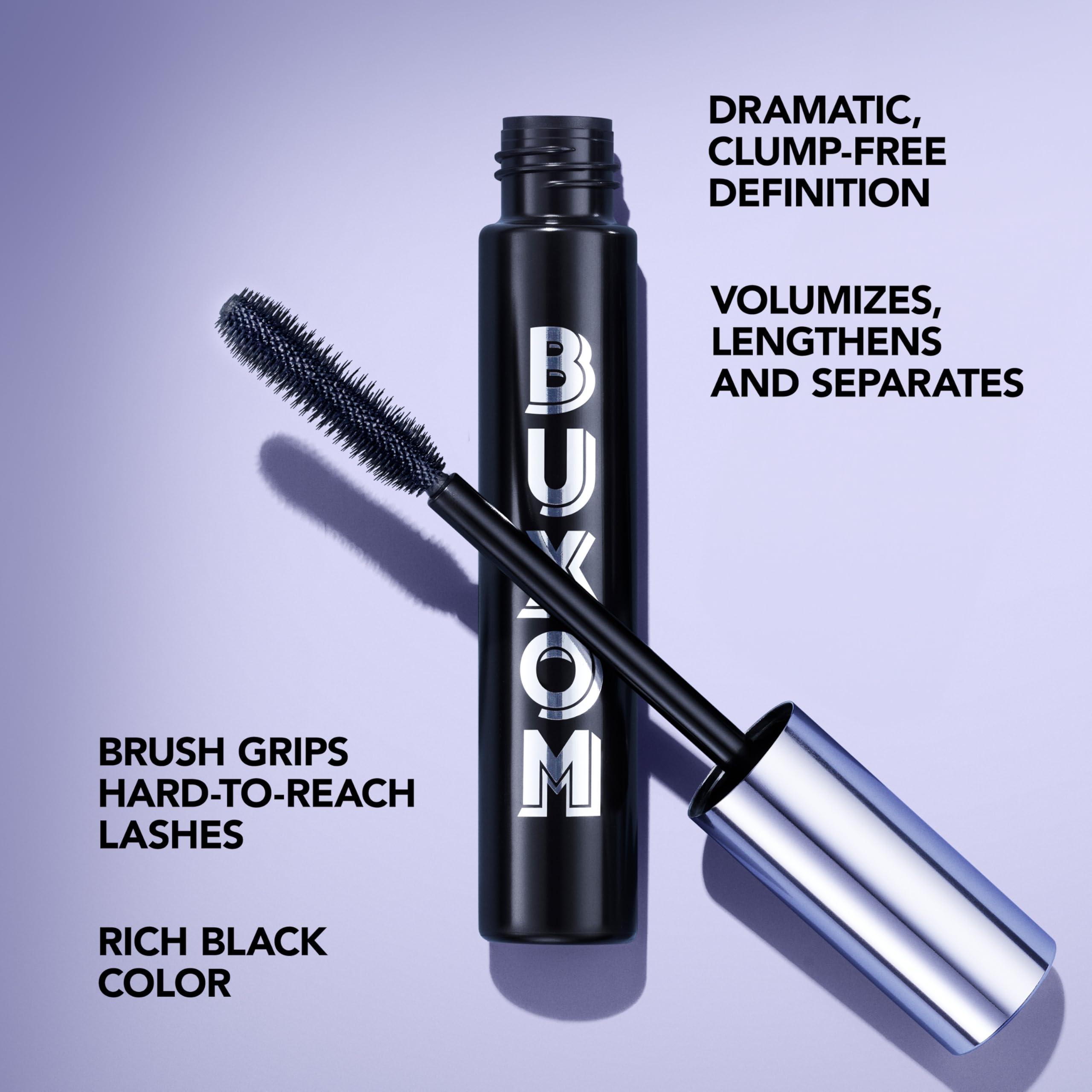 Close-up of glossy pigments in Buxom mascara enhancing lash shine.