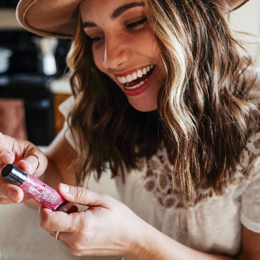 C.O. Bigelow cinnamint lip shine display highlighting all-day shine and aroma