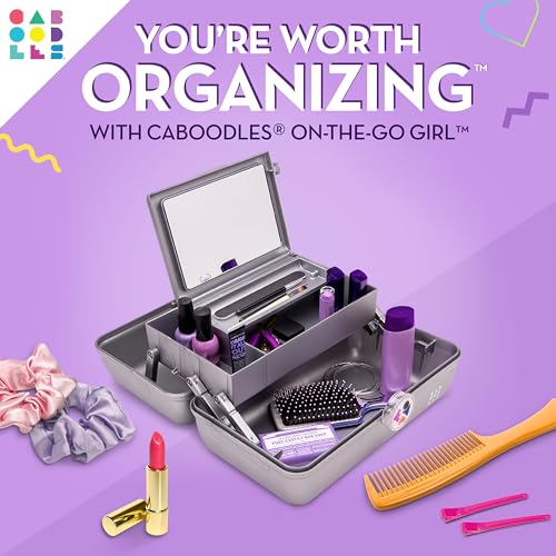 Caboodles Twilight Disco bottom compartment holds larger items like palettes and brushes during travel
