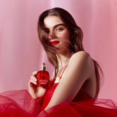 Cacharel Amor Amor bottle with engraved grenade cap highlighting bold, romantic scent cues.