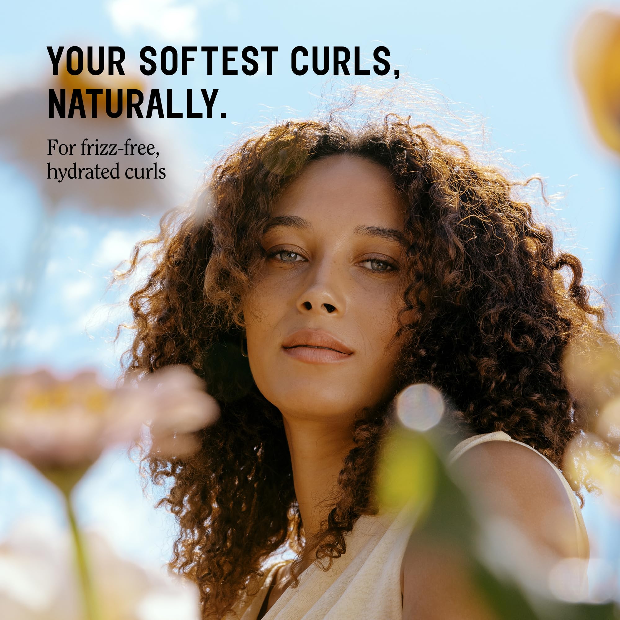 California Naturals Dream Curl Shampoo lather reveals soft definition and controlled frizz.
