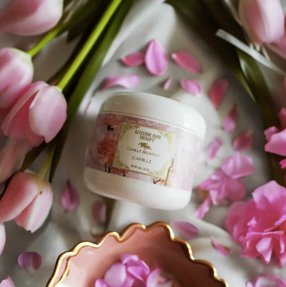 Scent notes of carnation petals and white iris in Camille Beckman hand cream.